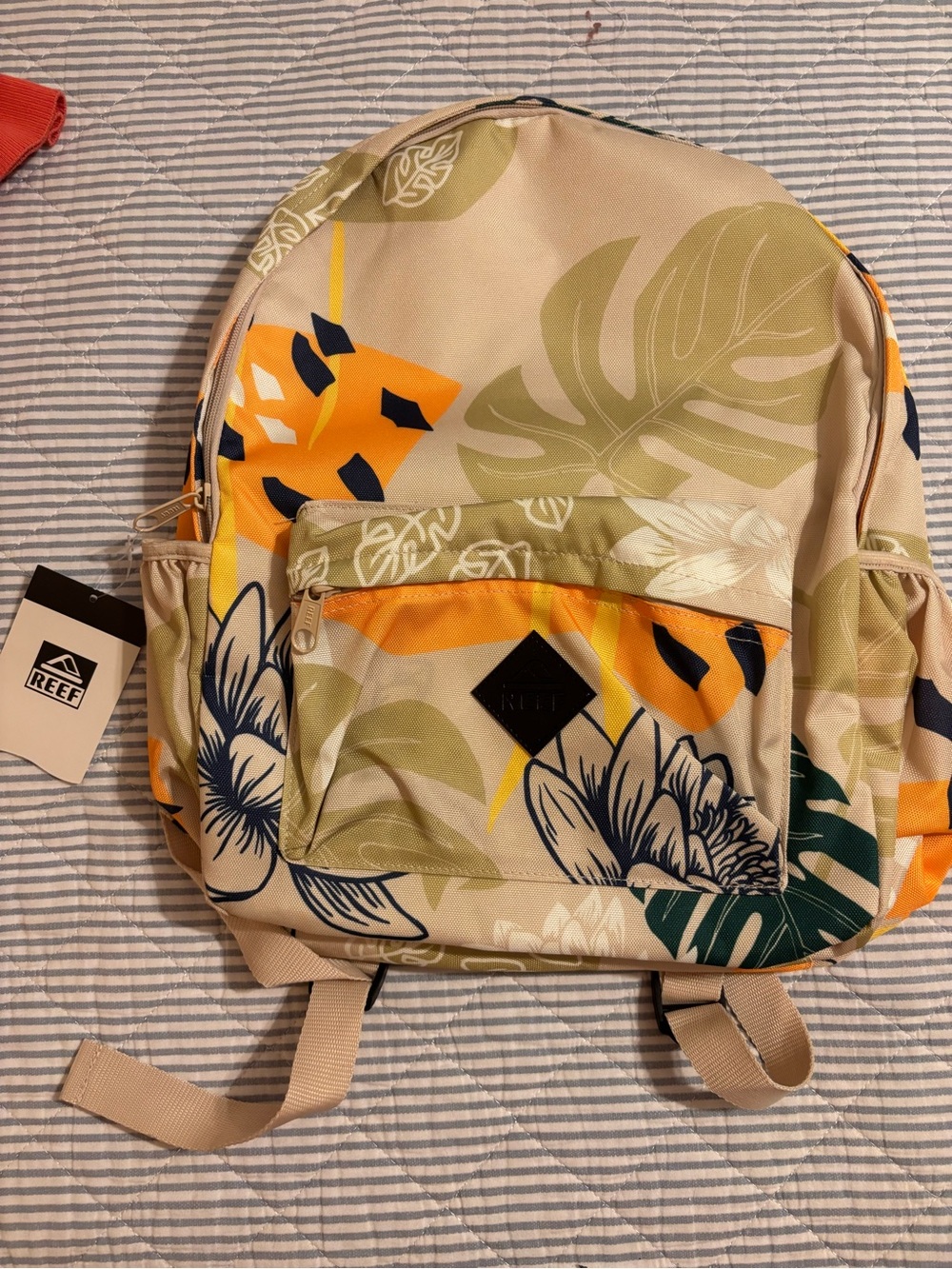 Reef Beige Floral Backpack with Green and Orange Accents